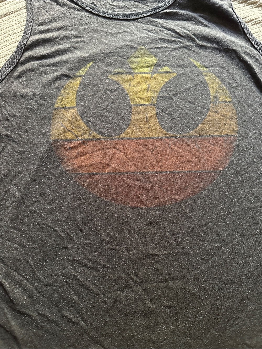 Men's Black Graphic Tank Top with Yellow and Brown Emblem